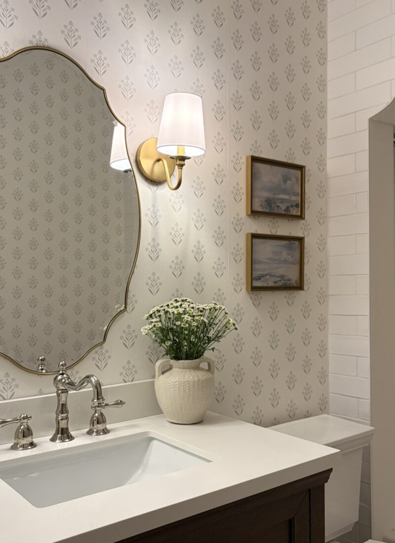 Guest bathroom with wallpaper and arched shower