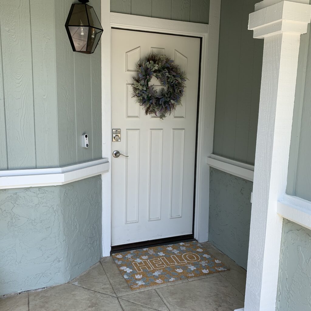 DIY doormat with flowers that matches exterior of house