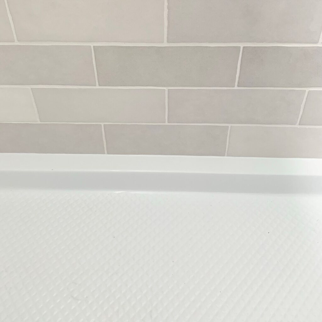silicone between tile and shower pan
