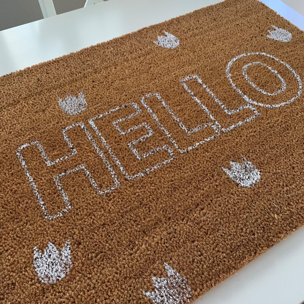 DIY doormat with flowers and hello