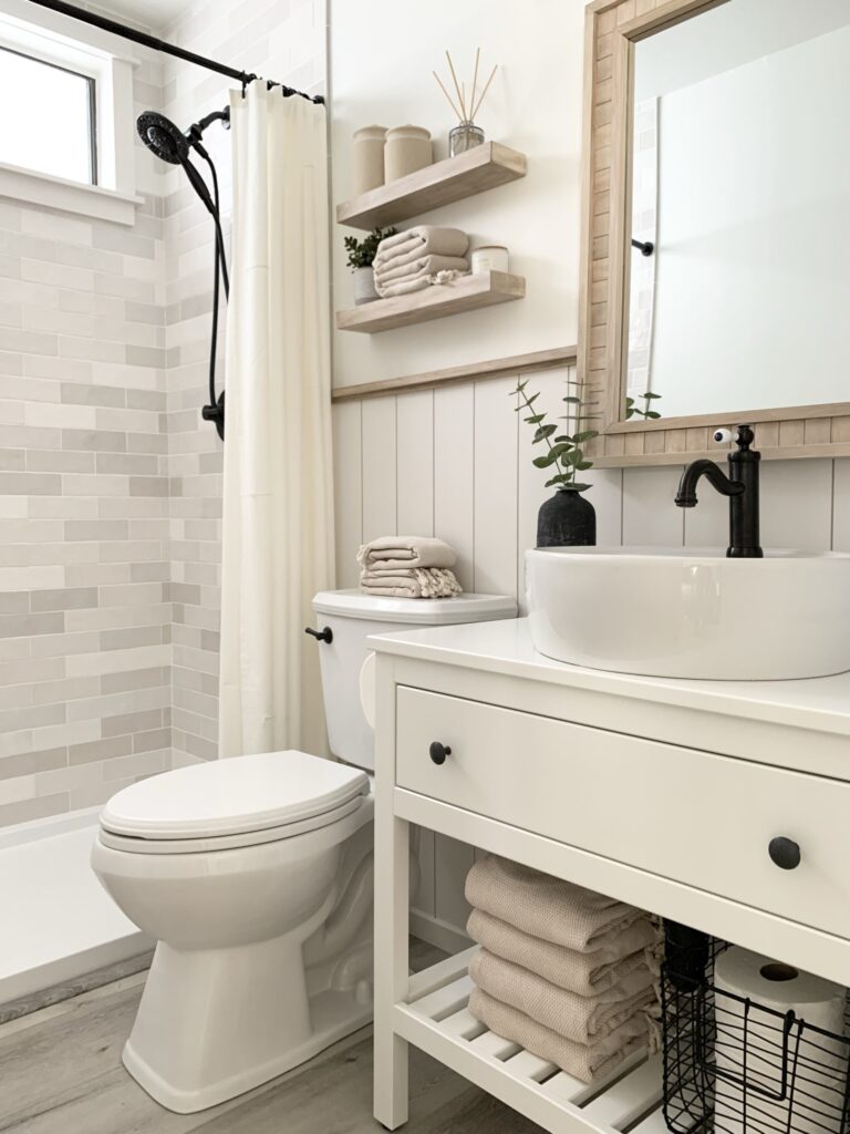 DIY bathroom remodel with zellige shower tile, IKEA Hemnes vanity, DIY wood mirror
