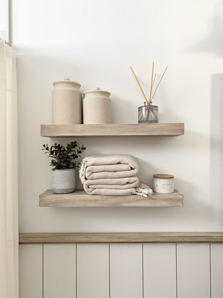 DIY beachy floating shelves with light gray vertical shiplap