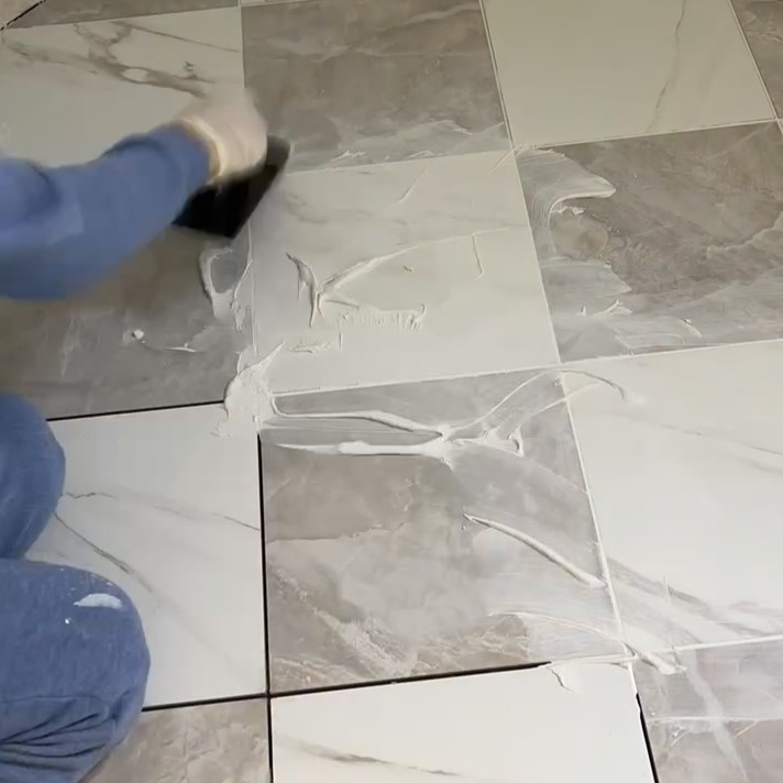 grouting white and gray checkered floor