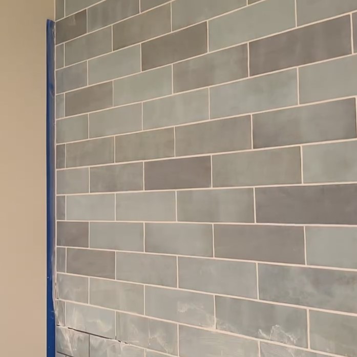 grouting wall tiles