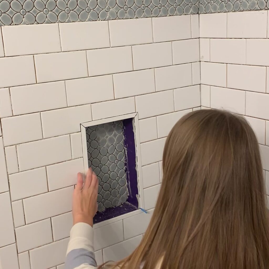 installing edge trim for shower niche