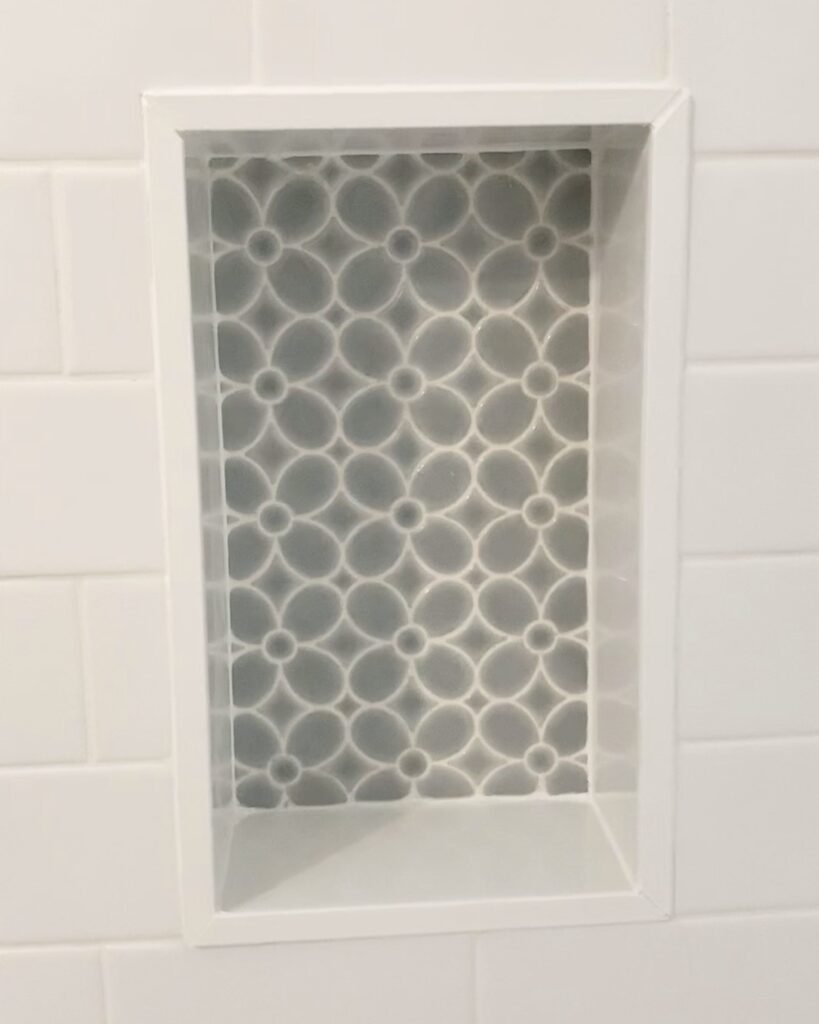 shower niche in white subway tile shower