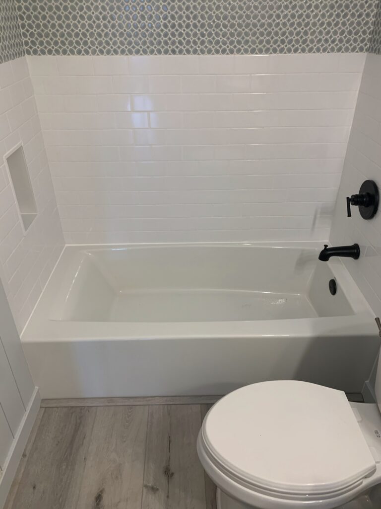 shower niche in white subway tile shower