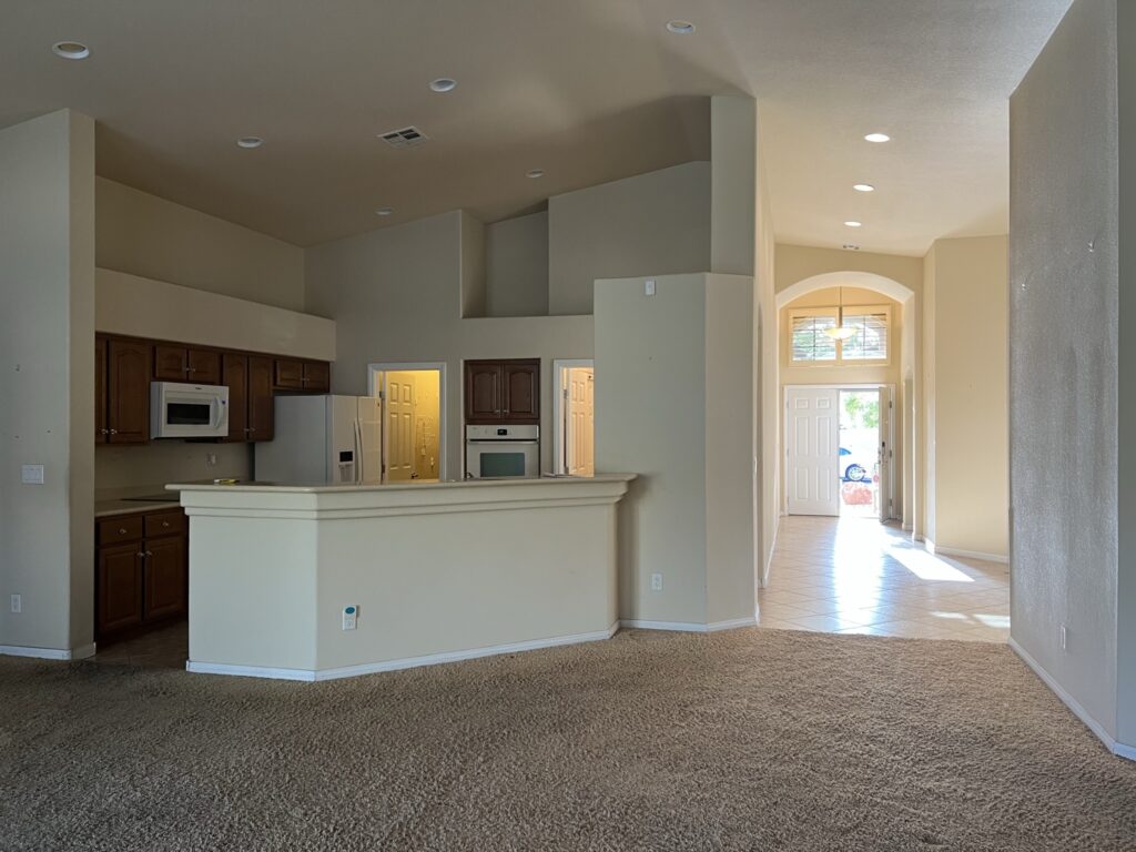 outdated kitchen with view of the front door