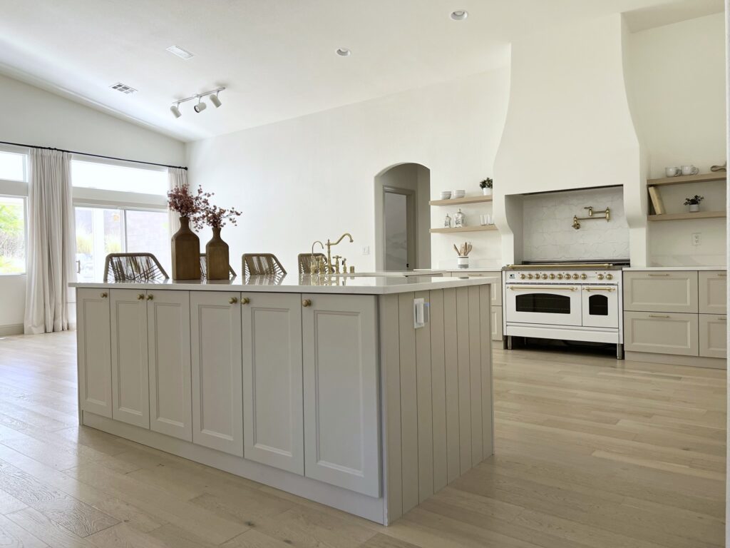 remodeled kitchen with IKEA cabinets and Silestone Calacatta Gold quartz countertops and Hallman range