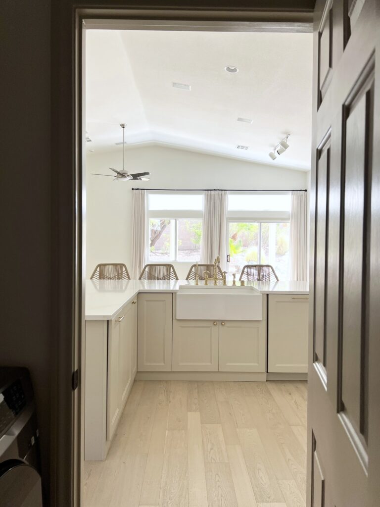 Accessible Beige kitchen cabinets with white apron sink