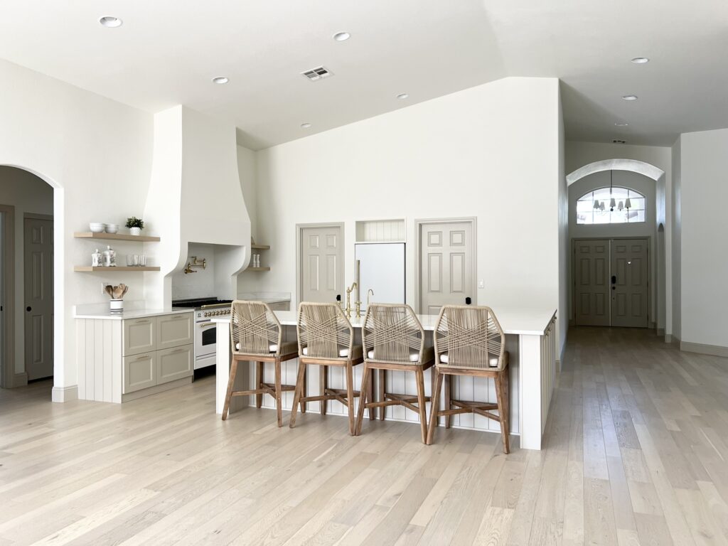 remodeled kitchen with IKEA cabinets and Silestone Calacatta Gold quartz countertops and white oak floors