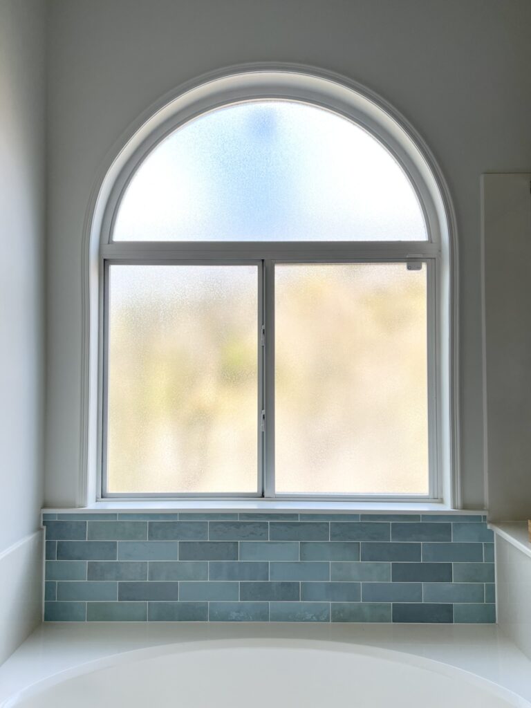 Bedrosians Cloe tile in Baby Blue above bathtub