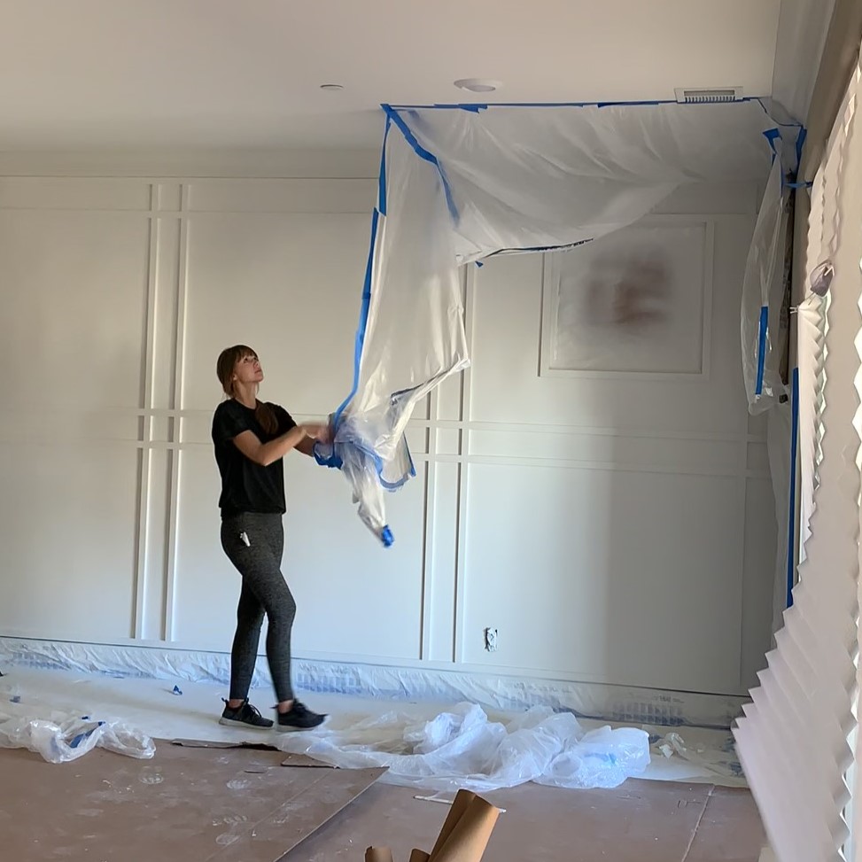 white paint on plaid wall