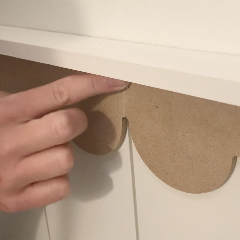 adding wood filler to scalloped trim