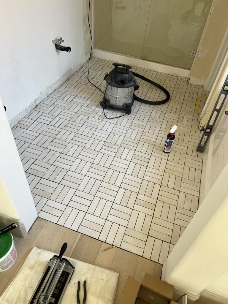 installing Bedrosians Celine Matte White tile in a crosshatch pattern