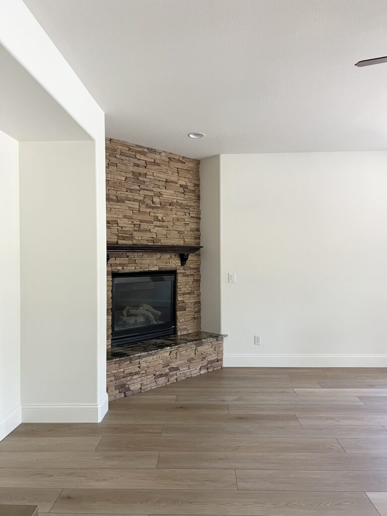 corner fireplace with stone veneer