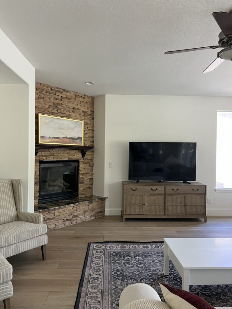 living room with corner fireplace