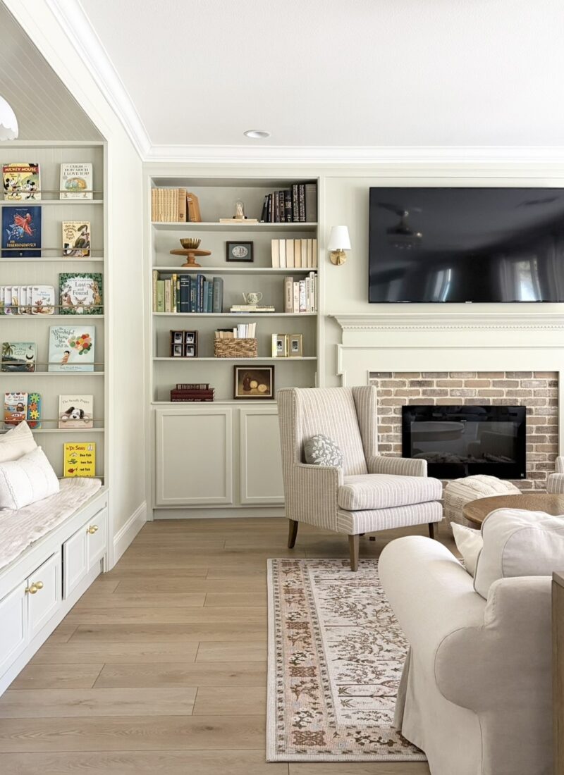 living room with built ins around fireplace