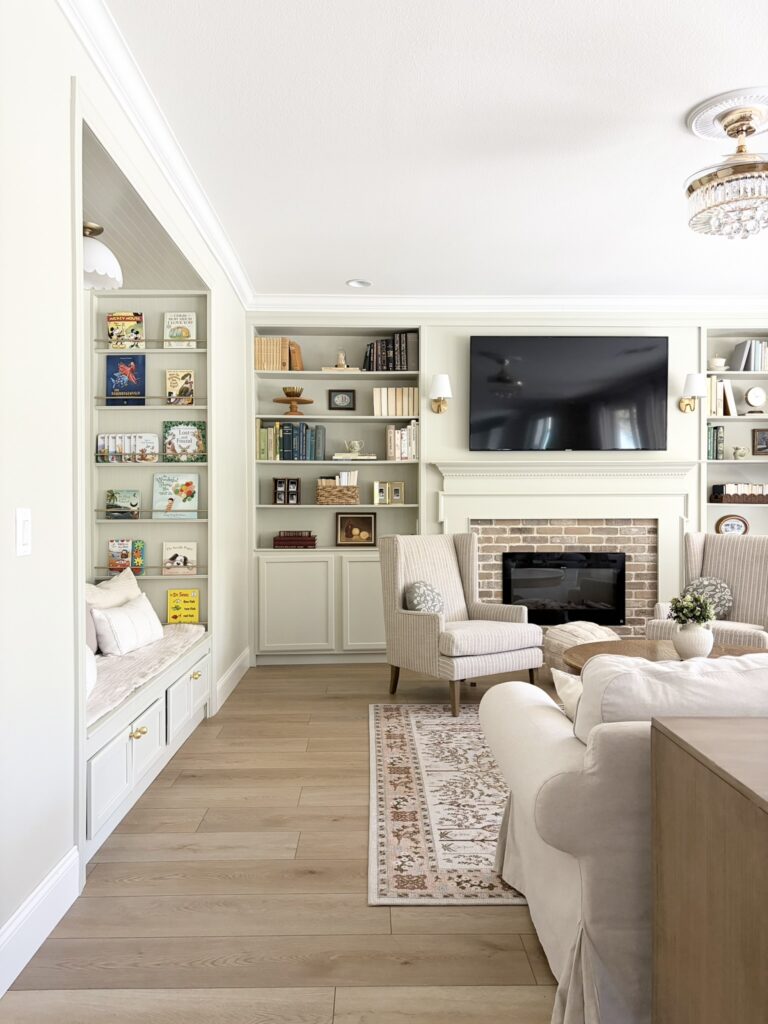 living room with kids reading nook and electric fireplace