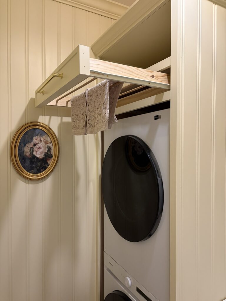 drying rack in a washer and dryer cabinet